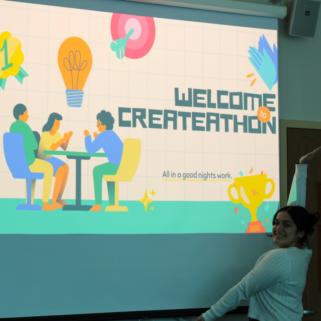 Welcome to CreateAThon presentation with a person standing in front of it.